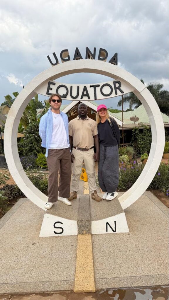 guide ali with client at equator